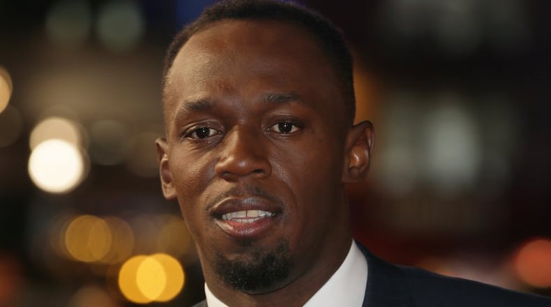 Athlete Usain Bolt poses for photographers upon arrival at the World premiere of the film ‘I Am Bolt’ in London, Monday, Nov. 28, 2016. (AP Photos/Tim Ireland)