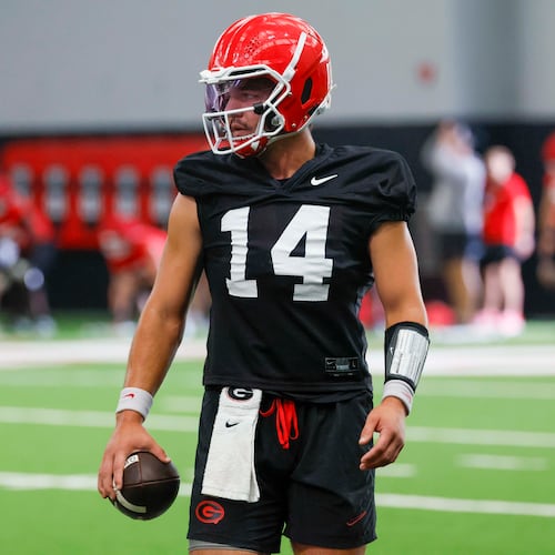 Georgia quarterback Gunner Stockton holds the ball during their first football practice at the University of Georgia practice facility, Wednesday, August 5, 2026, in Athens, Ga. (Miguel Martinez/AJC)