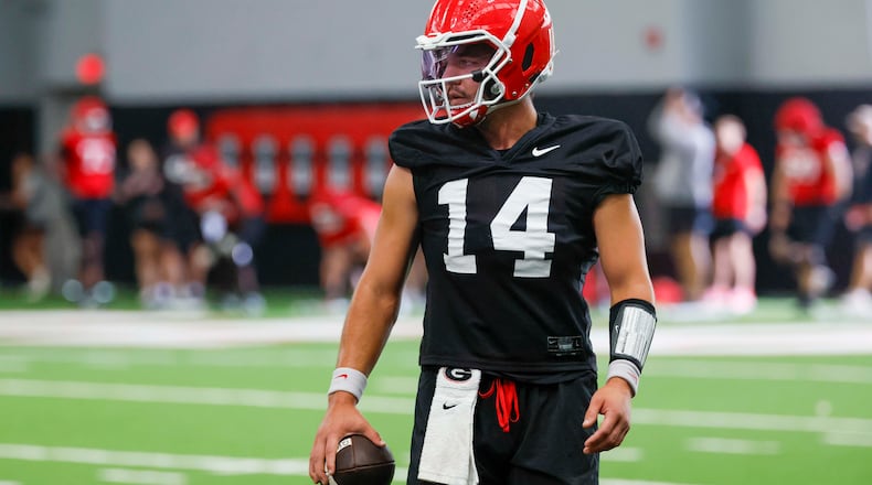 Georgia quarterback Gunner Stockton holds the ball during their first football practice at the University of Georgia practice facility, Wednesday, August 5, 2026, in Athens, Ga. (Miguel Martinez/AJC)