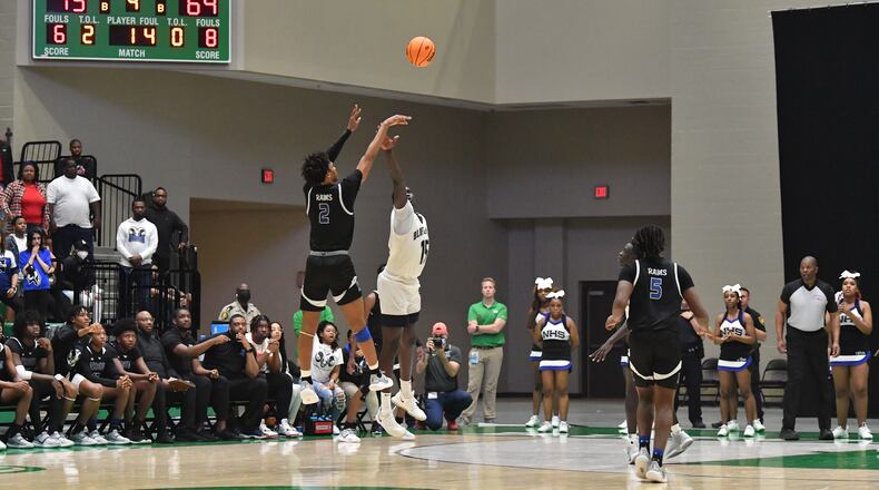 Newton's Stephon Castle shoots a 3-point basket over Norcross' Jerry Deng at the end of the fourth quarter during the 2022 GHSA Basketball Playoffs at Buford Arena. Norcross won 75-72 over Newton on Saturday in the semifinals. (Hyosub Shin / Hyosub.Shin@ajc.com)