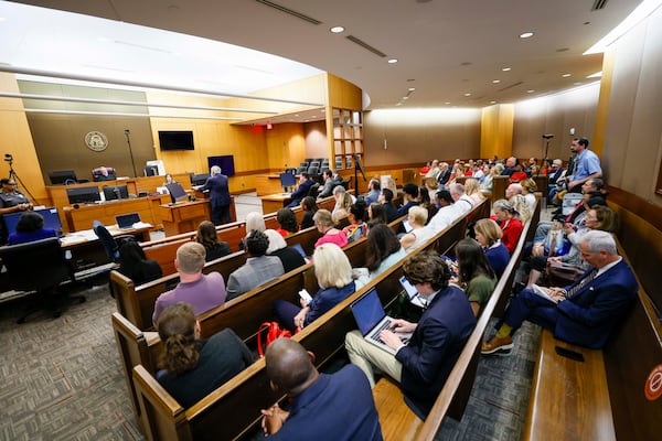 The benches at the Fulton County Courthouse were full Wednesday during a hearing where Democratic Commissioners Dana Barrett and Mo Ivory face a possible contempt citation after they defied a judge’s order requiring them to appoint two Republican nominees to the county Election Board. (Miguel Martinez/AJC)