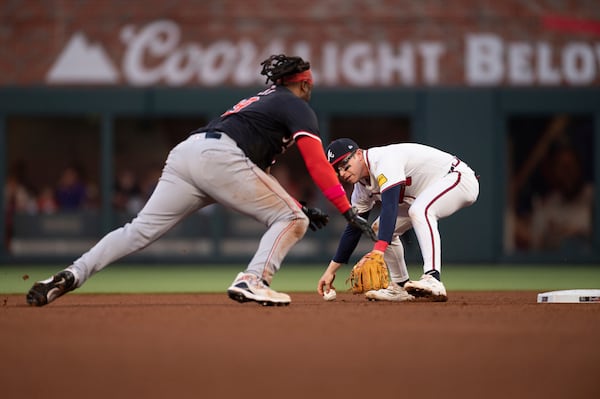 Atlanta Braves' Nick Allen (2) reaches to tag Washington Nationals' Josh Bell (19) in the fourth inning of a baseball game, Wednesday, May 14, 2025 in Atlanta. (AP Photo/Kathryn Skeean)