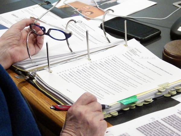 FILE - North Dakota Republican Sen. Diane Larson looks at a resolution that would urge the U.S. Supreme Court to overturn its 2015 decision that legalized same-sex marriage nationwide, March 12, 2025, at the state Capitol in Bismarck, N.D. (AP Photo/Jack Dura, File)
