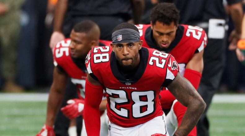 9/23/18 - Atlanta - Atlanta Falcons defensive back Justin Bethel (28), Atlanta Falcons running back Ito Smith (25) and Atlanta Falcons cornerback Isaiah Oliver (20) stretch during pregame activities. The Atlanta Falcons played the New Orleans Saints in an NFL football game Sunday, Sept 23, 2018, at Mercedes-Benz Stadium in Atlanta, GA. BOB ANDRES /BANDRES@AJC.COM