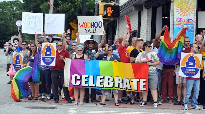 JUNE 26, 2013 ATLANTA Rally participants stood on all four four corners of the intersection. A rally of gay rights supporters cheers the Supreme Court ruling on gay marriage at the corner of Piedmont Ave and 10th Street in Midtown Atlanta Wednesday, June 26, 2013. KENT D. JOHNSON/KDJOHNSON@AJC.COM A 2013 rally in Midtown after a U.S. Supreme Court ruling on gay marriage. Kent D. Johnson, kdjohnson@ajc.com