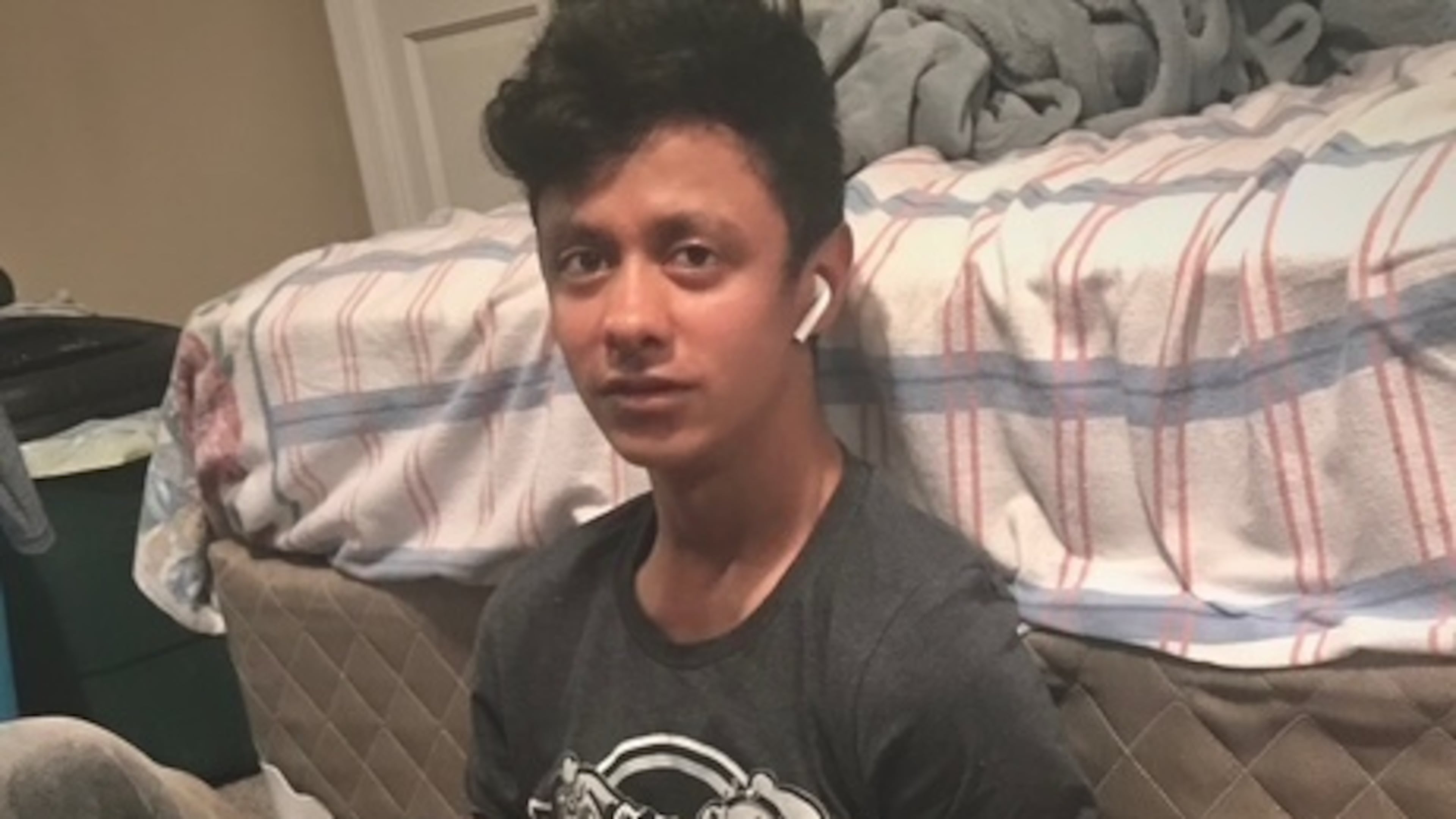 This photo provided by Henry Castro shows Josué Castro Rivera holding a cell phone in Virginia Beach, Va., in April 2021. (Henry Castro via AP)