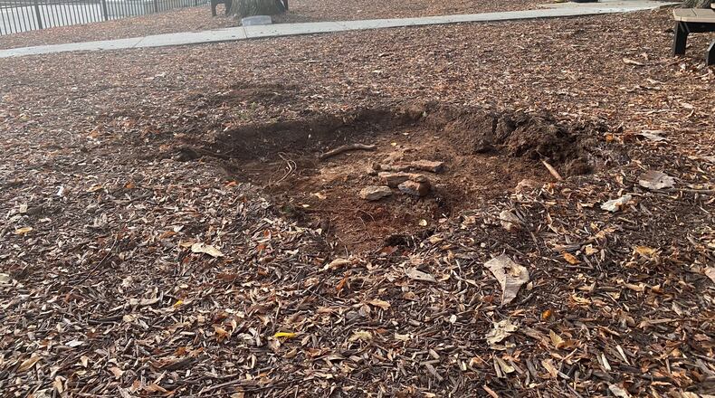 The former resting place of a cannon purported to a "relic of the Indian War of 1836." The cannon was removed Tuesday night, more than a century after it was placed near the Decatur square by the United Daughters of the Confederacy. TYLER ESTEP / TYLER.ESTEP@AJC.COM