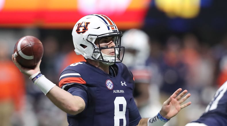December 2, 2017 Atlanta: Auburn Tigers quarterback Jarrett Stidham (8) throws against the Georgia Bulldogs during the first half of the SEC Football Championship at Mercedes-Benz Stadium, December 2, 2017, in Atlanta.  Curtis Compton / ccompton@ajc.com