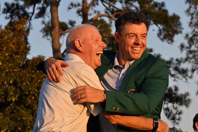 Rory McIlroy celebrates with his dad Gerry McIlroy at Green Jacket Ceremony at Augusta National Golf Club, Sunday, April 12, 2026, in Augusta, Ga. (Hyosub Shin/AJC)
