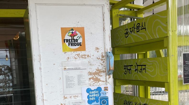 Community fridges popped up in the early days of the pandemic. Some fridges, such as this one at Refugee Coffee in Clarkston, continue to provide free food to anyone in need. Others in metro Atlanta have been removed. Nedra Rhone / nedra.rhone@ajc.com