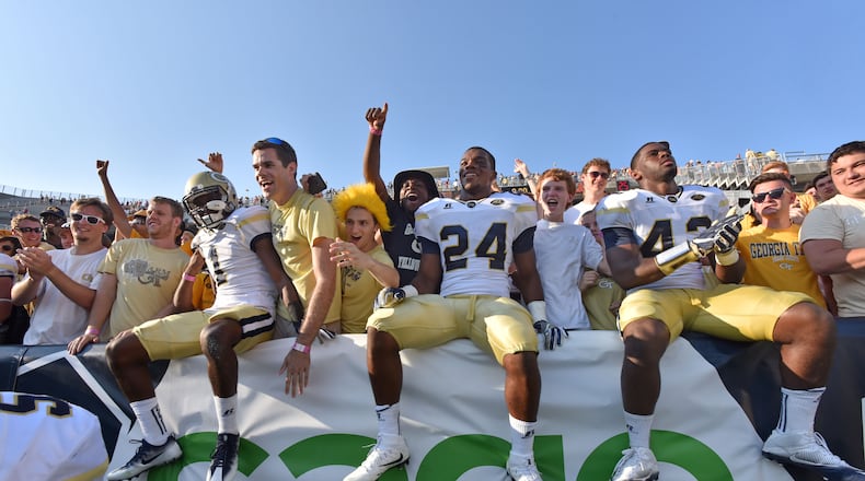 September 10, 2016 Atlanta - Georgia Tech Yellow Jackets players and fans celebrate their victory over the Mercer Bears at Bobby Dodd Stadium on Saturday, September 10, 2016. HYOSUB SHIN / HSHIN@AJC.COM