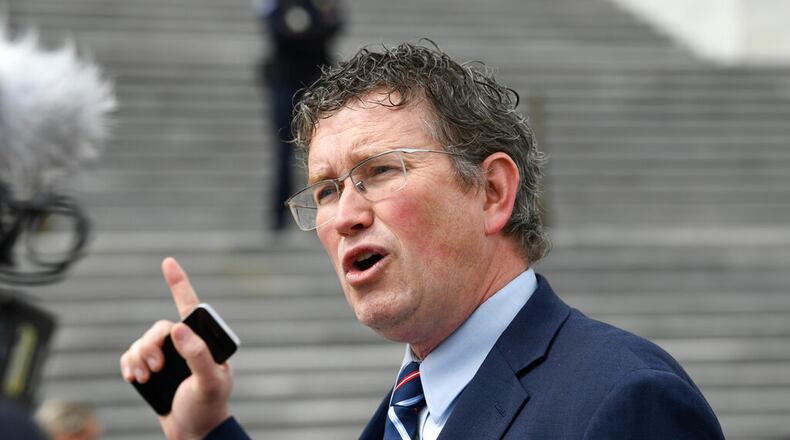 FILE - In this March 27, 2020 file photo Rep. Thomas Massie, R-Ky., talks to reporters before leaving Capitol Hill in Washington. Massie, a Kentucky congressman said Kyle Rittenhouse charged with fatally shooting two people with a semi-automatic rifle during the unrest in Wisconsin showed “incredible restraint" and acted in self-defense. (AP Photo/Susan Walsh, File)