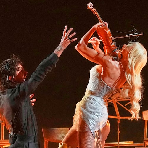 Linda Lampenius and Pete Parkkonen from Finland perform the song "Liekinheitin" during the first semifinal of the 70th Eurovision Song Contest in Vienna, Austria, Tuesday, May 12, 2026. (AP Photo/Martin Meissner)