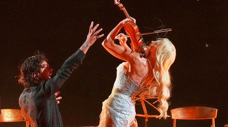 Linda Lampenius and Pete Parkkonen from Finland perform the song "Liekinheitin" during the first semifinal of the 70th Eurovision Song Contest in Vienna, Austria, Tuesday, May 12, 2026. (AP Photo/Martin Meissner)