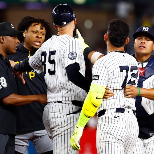 Pittsburgh Pirates' Gregory Soto, left, exchanges words with New York Yankees' José Caballero (72), right, during the ninth inning of a baseball game, Monday, July 20, 2026 in New York. (AP Photo/Noah K. Murray)