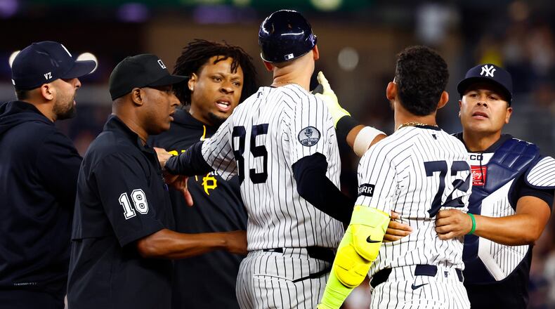 Pittsburgh Pirates' Gregory Soto, left, exchanges words with New York Yankees' José Caballero (72), right, during the ninth inning of a baseball game, Monday, July 20, 2026 in New York. (AP Photo/Noah K. Murray)