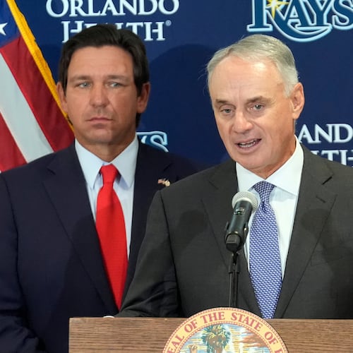 Major League Baseball commissioner Rob Manfred, right, speaks during a new baseball stadium news conference as Florida Gov. Ron DeSantis looks, Tuesday, Feb. 3, 2026, at Hillsborough College in Tampa, Fla. (AP Photo/Chris O'Meara)