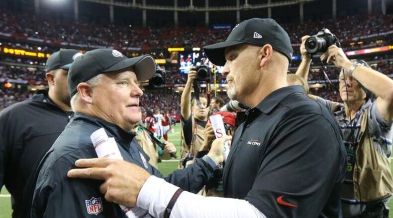 One of these guys still has a job. (Curtis Compton/AJC photo)