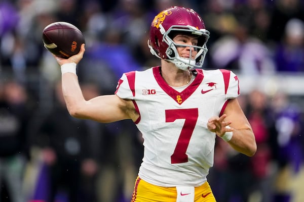 FILE - Southern California quarterback Miller Moss looks to throw against Washington during the first half of an NCAA college football game Saturday, Nov. 2, 2024, in Seattle. (AP Photo/Lindsey Wasson, File)