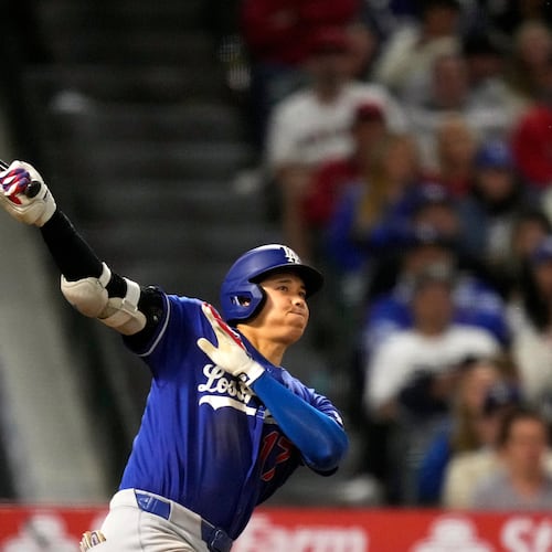 Los Angeles Dodgers' Shohei Ohtani hits a two-run triple during the eighth inning of a baseball game against the Los Angeles Angels, Saturday, May 16, 2026, in Anaheim, Calif. (AP Photo/Mark J. Terrill) CORRECTION: After official review, changed from three-run inside-the-park home run to two-run triple after a throwing error