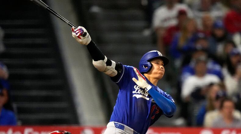 Los Angeles Dodgers' Shohei Ohtani hits a two-run triple during the eighth inning of a baseball game against the Los Angeles Angels, Saturday, May 16, 2026, in Anaheim, Calif. (AP Photo/Mark J. Terrill) CORRECTION: After official review, changed from three-run inside-the-park home run to two-run triple after a throwing error
