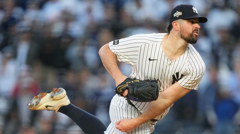 FILE - New York Yankees pitcher Carlos Rodón delivers against the Boston Red Sox during the first inning of Game 2 of an American League wild-card baseball playoff series, Oct. 1, 2025, in New York. (AP Photo/Yuki Iwamura, File)