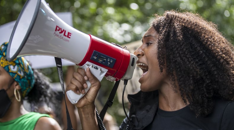 A protestor chants during a peaceful protest march from Cleopas Park to Atlanta City Hall, Sunday, June 7, 2020. (ALYSSA POINTER / ALYSSA.POINTER@AJC.COM)