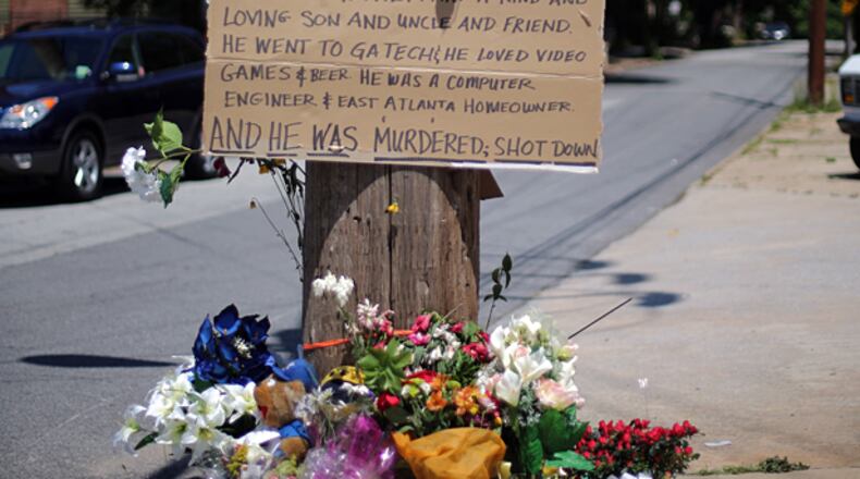 A memorial at May Avenue SE and Flat Shoals Avenue SE in East Atlanta marks the intersection where Patrick Cotrona was shot and killed Saturday evening while walking with friends.