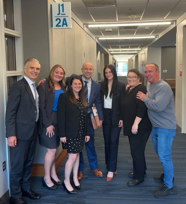 Dr. James Quinn (left) won a $58 million jury verdict Wednesday in Fulton County State Court alongside his legal team, (left to right), attorney Caitlyn Clark, paralegal Rachael Currie, attorneys Steve Lowry and Anastasia Zevan and trial technicians Liz Kemp and Bob Poston. (Courtesy Harris Lowry Manton)