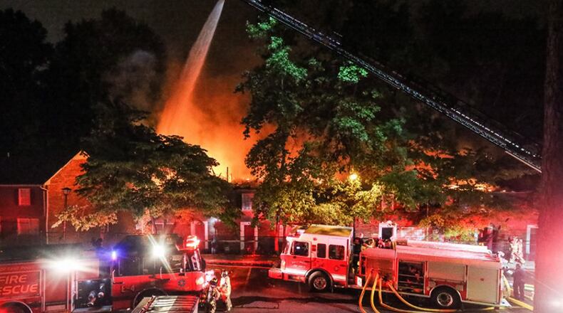 Sandy Springs Fire Rescue units respond to an apartment fire. The city will pay $642,899 total to buy and equip a new fire engine/pumper for Fire Rescue Station No. 7, covering the “Panhandle” area on the north side of the city. JOHN SPINK / JSPINK@AJC.COM