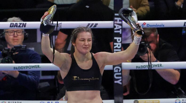 Ireland's Katie Taylor celebrates after beating Flora Pili of France in their super lightweight world title fight in Dublin, Saturday, Sept. 5, 2026. (AP Photo/Peter Morrison)