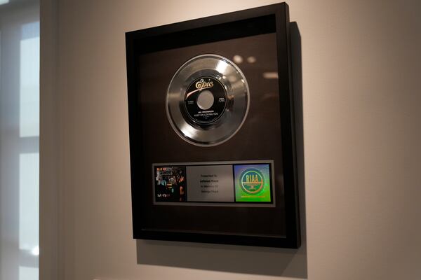 An REO Speedwagon record is on loan from George Floyd's sister LaTonya Floyd as part of a collection of objects that tell stories about peoples' lives in public housing at the National Public Housing Museum, built in the last remaining building of the 1930s WPA-era Jane Addams Homes, Wednesday, March 19, 2025, in Chicago. (AP Photo/Erin Hooley)
