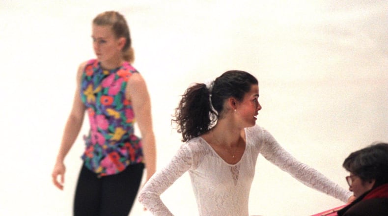 Womens figure skater Tonya Harding skates by rival skater Nancy Kerrigan during practice in Lillehammer, Norway, at the 1994 Winter Olympics on Feb. 17, 1994.