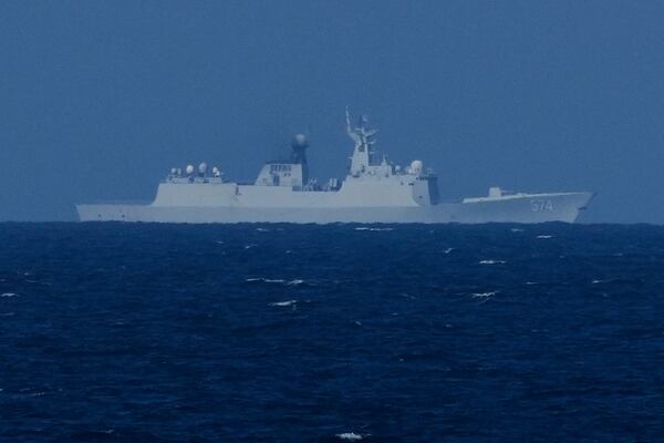 A China Navy Ship with bow number 574 observes the Philippines United States Japan Multilateral Maritime Cooperative Activity off a disputed South China Sea shoal on Friday, March 28, 2025. (AP Photo/Aaron Favila)