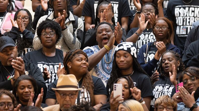 Black Voters Matter activists applaud at a press conference at the Capitol in Atlanta on Wednesday, Feb. 28, 2024. (Arvin Temkar/The Atlanta Journal-Constitution/TNS)