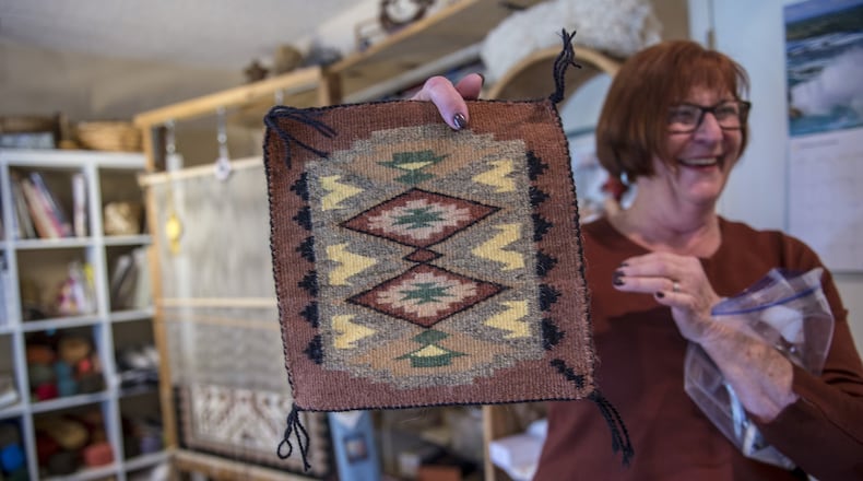 Marilyn Greaves is one of California’s top Navajo-style weavers and her home is filled with her art work like this one she is holding and that of work she has collected in Fair Oaks, Calif., on Wednesday, Jan. 31, 2018. (Tenee C. Byer/Sacramento Bee/TNS)