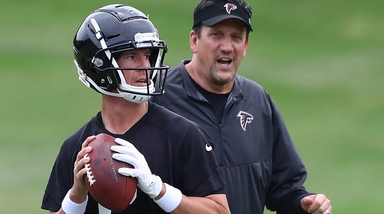 Atlanta Falcons quarterbacks coach Greg Knapp works with Matt Ryan during team practice on Tuesday, June 5, 2018, in Flowery Branch.