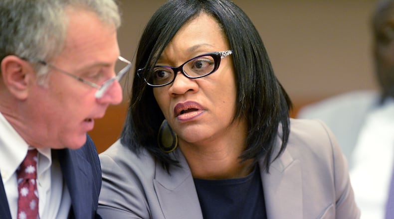 Former Dobbs Elementary School principal Dana Evans talks with her lawyer, Bob Rubin. (Kent D. Johnson / AJC file photo / September 2015)