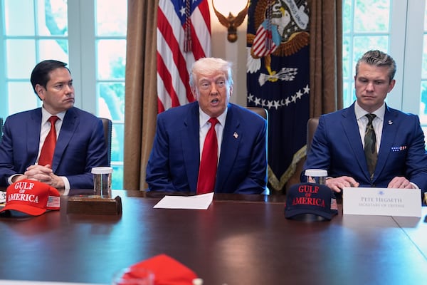 President Donald Trump speaks during a cabinet meeting at the White House, Wednesday, April 30, 2025, in Washington, as Secretary of State Marco Rubio, left, and Secretary of Defense Pete Hegseth, look on. (AP Photo/Evan Vucci)