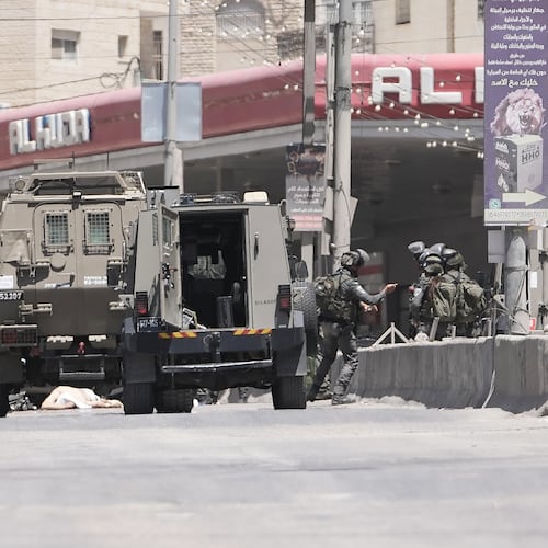 Israeli border police officers operate in the West Bank refugee camp of Qalandia, after Israeli forces shot and killed a suspected militant who opened fire on troops Monday, May 11, 2026. (AP Photo/Mahmoud Illean)