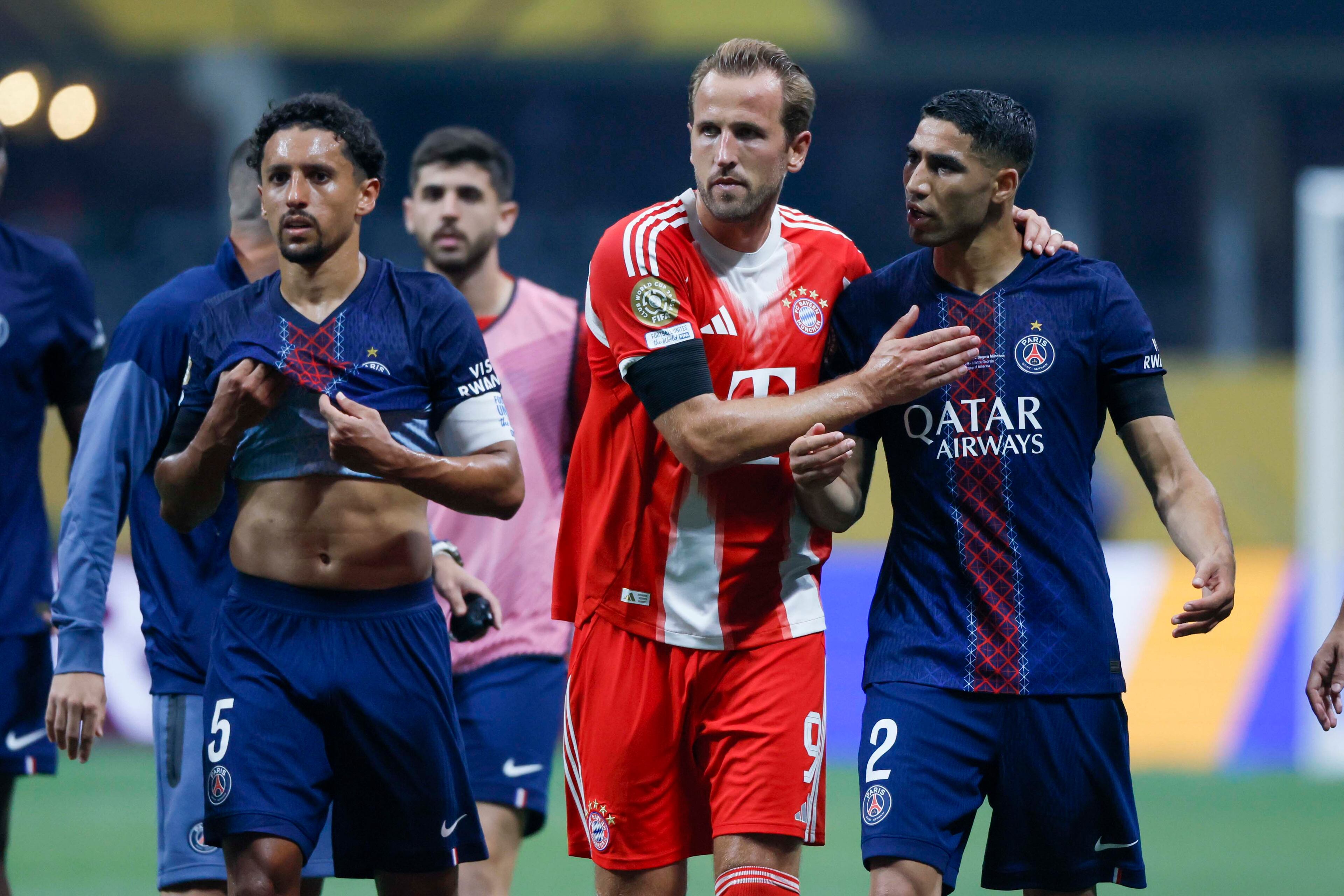 Bayern Munich forward Harry Kane (9) and Paris Saint-Germain defender Achraf Hakimi (2) speak at the end of the first half during the Club World Cup quarterfinal soccer match between Paris Saint-Germain and Bayern Munich, Saturday, July 5, 2025.
(Miguel Martinez/ AJC)