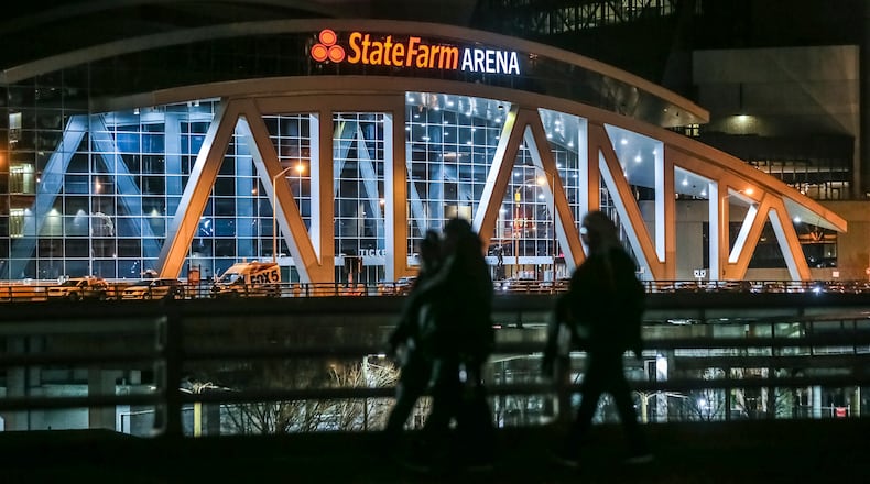 January 24, 2020 Atlanta: Morning walkers stroll past State Farm Arena on Monday morning, Jan. 27, 2020 where the Atlanta Hawks played Sunday night mindful of the tragic deaths of Kobe Bryant, who was killed in a helicopter crash along with his daughter and seven others Sunday. Atlanta Hawks Trae Young reflected on the tragedy Sunday following the Hawks game at State Farm Arena. âWe didnât have a lot on our mind besides Kobe and Gigi and everybody in the accident,â Young told Fox Sports Southeastâs Andre Aldridge in his postgame interview after his electric performance. âWe just wanted to go out and play hard, have that mamba mentality.â Gianna, a budding student of the game, was a big fan of Youngâs, who attended some basketball camps of Bryantâs back in high school and watched him play in Oklahoma City in the later years of his career, when he wore No. 24 (the Wizards took a 24-second shot-clock violation to start Sundayâs game). Bryant eventually got in contact with Youngâs trainer, Alex Bazzell, and enlisted his help working with Gianna. She and Bryant sat courtside for two Hawks games this season: the loss in Los Angeles Nov. 17 and the loss in Brooklyn Dec. 21.  In the wake of the crash, Young tweeted about meeting Gianna for the first time after the Lakers game, posting a picture of the two of them about to embrace in a hallway in Staples Center as Bryant looked on. âShe told me how much she loved watching me play,â Young said of the encounter, a smile cracking through the sadness. âShe was a big fan of mine.â JOHN SPINK/JSPINK@AJC.COM