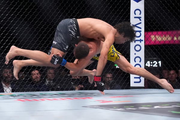 Payton Talbott, left, fights Felipe Lima in a bantamweight fight at UFC 317, Saturday, June 28, 2025, in Las Vegas. (AP Photo/John Locher)