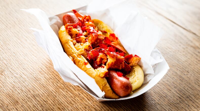 Treat yourself to a fancy frank topped with lobster and truffle butter at Drafts + Dogs in Ponce City Market.