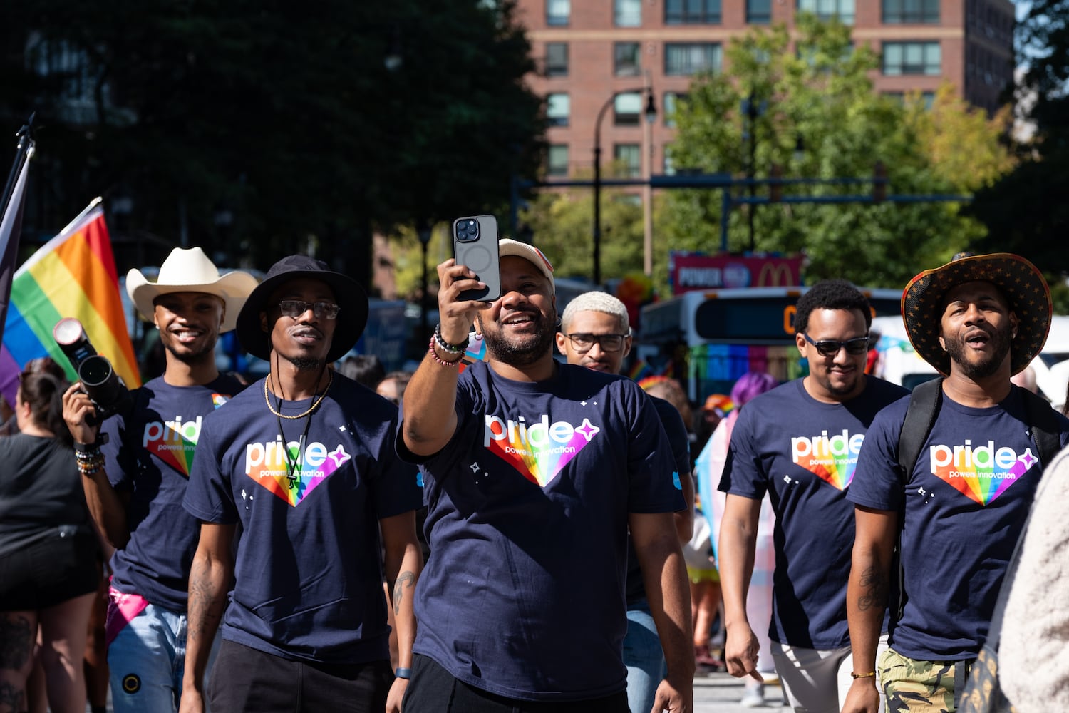 Jerrell Hardnett shoots a video with his friends before the start of the Atlanta Pride Parade on Sunday, Oct. 12, 2025. (Ben Gray for the AJC)