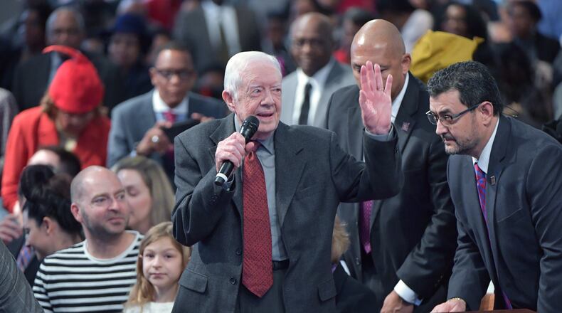 Former President Jimmy Carter waves as he is recognized during the last Sunday church service of 2018 at the historic Ebenezer Baptist Church in Atlanta on December 30, 2018. The Carter family selected the historic Atlanta church for their final Sunday church service of the year. (Photo: HYOSUB SHIN / HSHIN@AJC.COM)