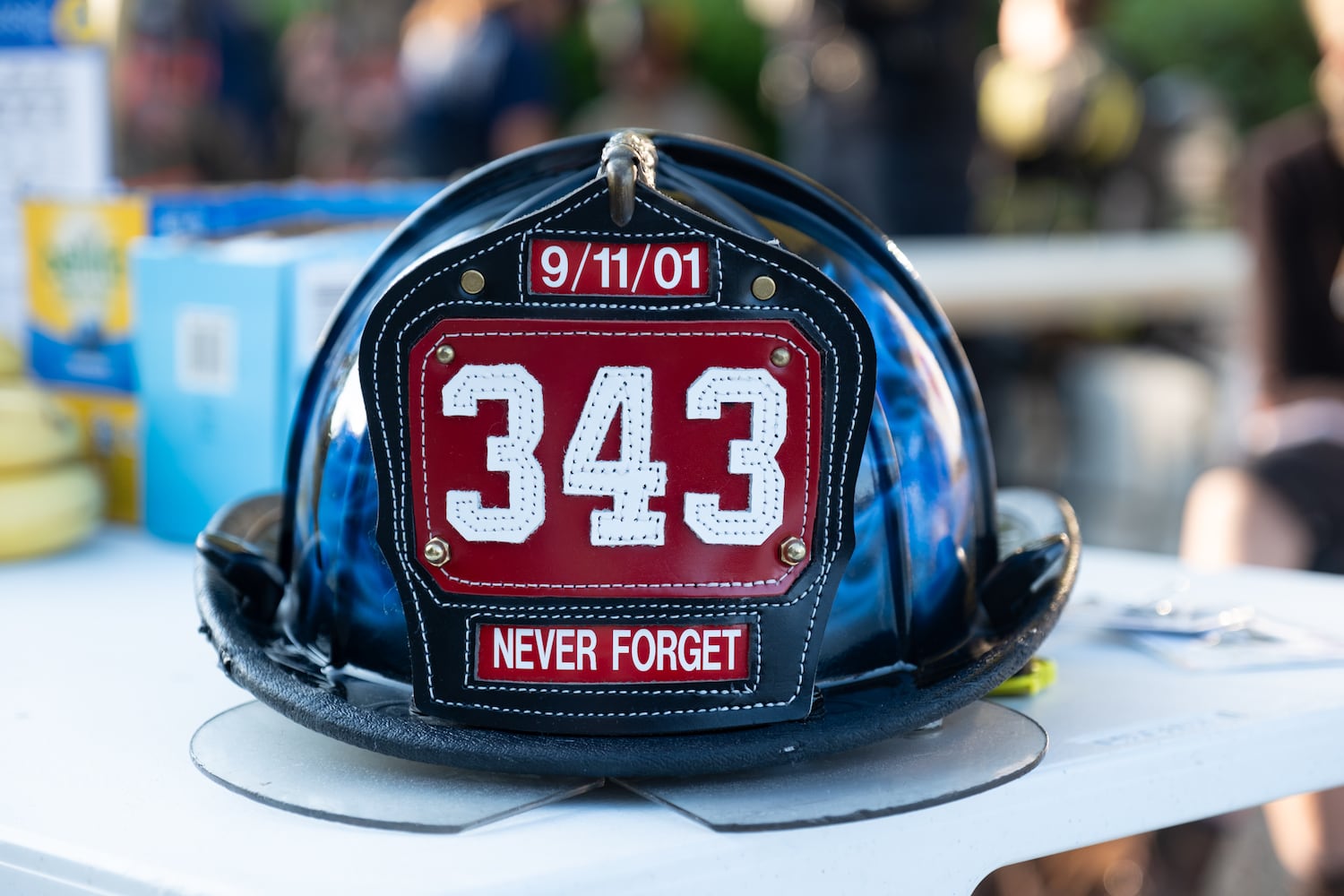 A 9/11 memorial fire helmet sits on display before firefighters climb Stone Mountain for the annual 9/11 memorial on Thursday, Sept. 11, 2025.   Ben Gray for the Atlanta Journal-Constitution