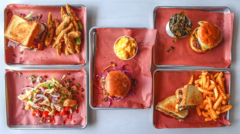 What you'll find at the new location of Fox Bros. Bar-B-Q on Atlanta's Upper Westside includes Texas Turkey (upper left), BBQ Wedge (lower left), Pulled Mushroom (center), Terlingua Pride (upper right), and Foxy Melt (lower right). (Chris Hunt for The Atlanta Journal-Constitution)