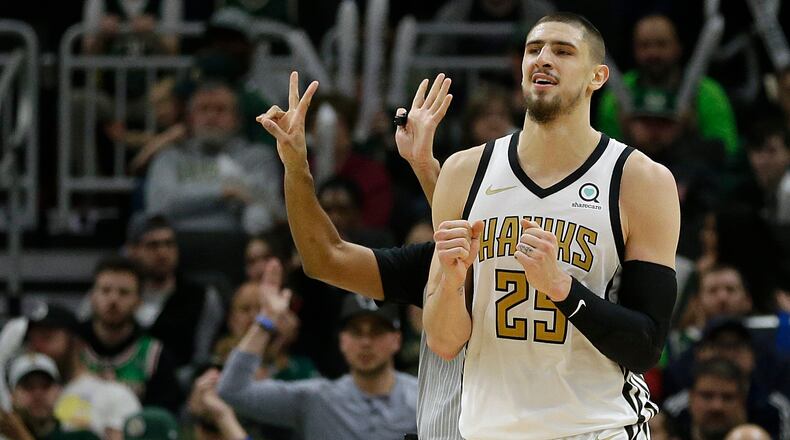 Atlanta Hawks' Alex Len reacts after being called for an offensive foul during the second half Sunday, April 7, 2019, against the Milwaukee Bucks in Milwaukee.