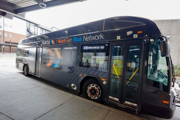 A Route 39 MARTA bus is seen decorated with promotional signage for the NextGen Bus Network outside the Lindbergh Center Station Bus Loop on Thursday, March 26, 2026.   (Miguel Martinez/AJC)